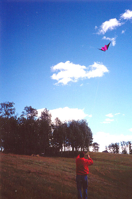 Eldon Lendon flying a kite at Bedore Lake.